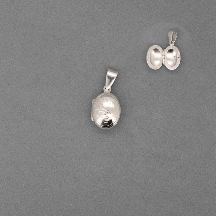 CDJ0451 DIJE RELICARIO OVALADO PEQUE„O TALLADO